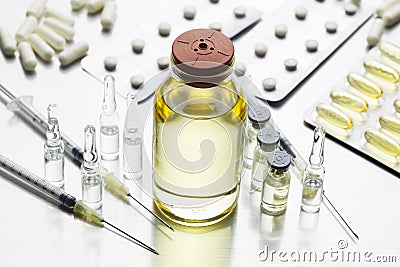 Liquid medicine, ampoules, syringes with needles Stock Photo