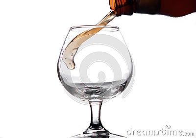 The liquid is poured into a glass and spray Stock Photo