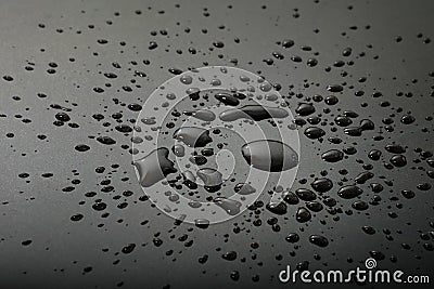 Liquid or water drops splash on the black floor Stock Photo