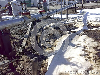 Liquidation of the oil spill. Locksmiths are engaged in eliminating oil leakage and repairing equipment. Workers liquidate the oil Stock Photo