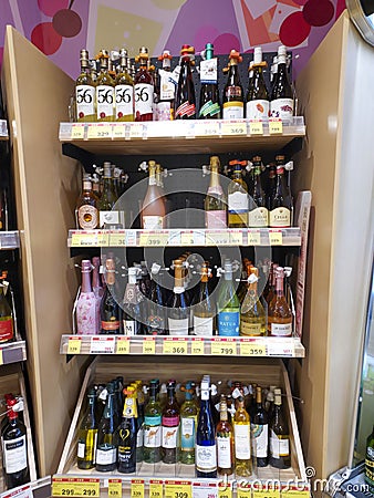 Liquor shelf in supermarket chains. Alcohol sales area. Alcohol shelf or alcohol section. Editorial Stock Photo