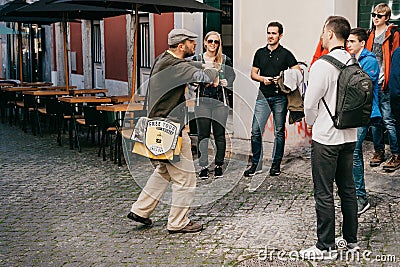 Lisbon, June 18, 2018: A guide from local residents tells tourists on a free tour of the sights of the city. Free tour Editorial Stock Photo