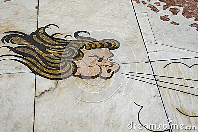 Lisbon, Portugal, August 22, 2018: Fragment of the mosaic of the wind rose. The marble tile shows the face of the wind God. Copy Editorial Stock Photo