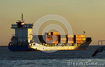 LISBON, PORTUGAL - JULY, 06, 2018: Cargo ship floating on the river Tagus in Lisbon, Portugal. Editorial Stock Photo