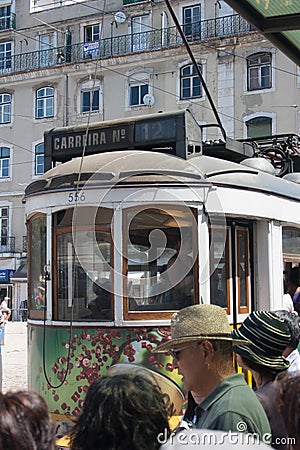 LISBON, PORTUGAL - July 23, 2011: Traditional yellow trams on a street in Lisbon Editorial Stock Photo