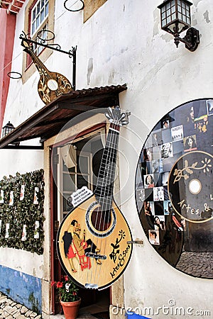 Narrow and colorful streets, facades and balconies of Obidos Editorial Stock Photo