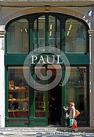 Lady shopper outside Paul Bakery and Cafe Rua Augusta Lisbon Portugal. Editorial Stock Photo