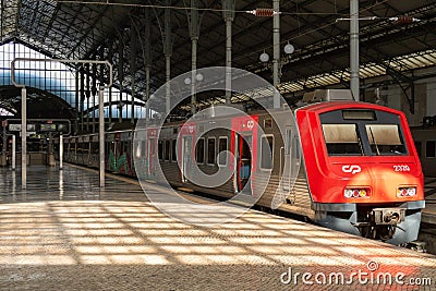 Regional red train at Rossio Railway Station in Lisbon Editorial Stock Photo