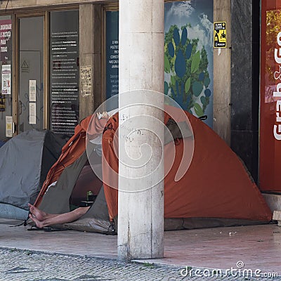Homeless man in a tent in Lisbon, Portugal as the city becomes increasingly unaffordable for many Editorial Stock Photo