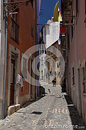 Lisbon, Portugal. Narrow street in the Alfama quarter Editorial Stock Photo