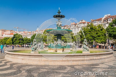 LISBON, PORTUGAL - OCTOBER 10, 2017: Fountain at the King Pedro IV Square Rossio in Lisbon, Portug Editorial Stock Photo