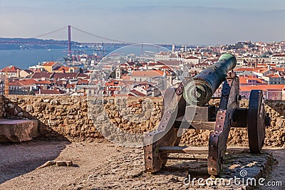 Lisbon, Portugal. Old bronze cannon in Sao Jorge aka Saint George Castle and a view of Lisbon Baixa Distric Stock Photo