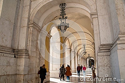 Lisbon, Portugal, people in the arch of a historic building in the city center, view of the Portuguese city, European cityscape Editorial Stock Photo