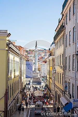 LISBON, PORTUGAL - SEPTEMBER 13, 2019: Calcada do Carmo street and Column and statue of Dom Pedro IV at the Rossio Editorial Stock Photo