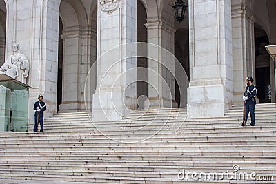 Two policemen on guard in Lisbon. Cops in uniform with rifles near historical building. Guard and security concept. Editorial Stock Photo