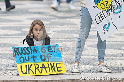 10-29-2022 LISBON, PORTUGAL: Ukrainian protest in Lisbon - little girl holds a poster in support of Ukraine Editorial Stock Photo