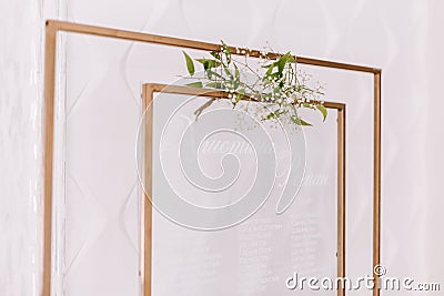 List, plan, chart of the seating area of guests at the tables at restaurant. Tables wedding guests on the easel on wedding Stock Photo