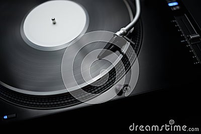 Listen to music with hi fi turntable player and vinyl record. DJ turn table plays analog disc with musical tracks Stock Photo