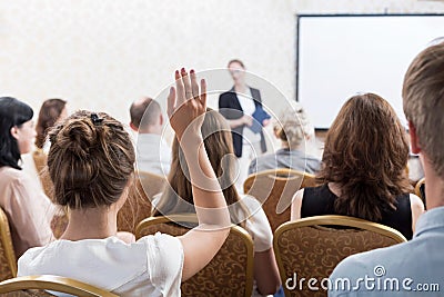 Listener raising hand to ask Stock Photo