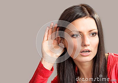 Listening young woman Stock Photo