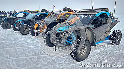 Listvyanka, Russia - February 29, 2020: Several buggy cars stand in the snow. Editorial Stock Photo