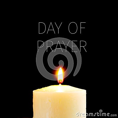 Lit candle and text day of prayer Stock Photo