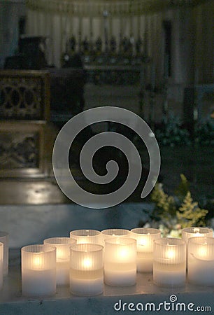 lit candles inside a church Stock Photo