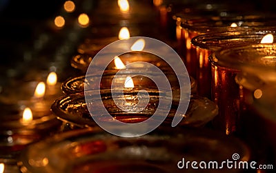 Lit Candles inside Duomo Cathedral. Milano Stock Photo