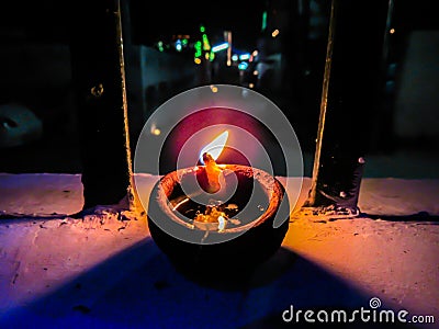Lit diya lamp. Clay diya. Traditional Diwali festival. Stock Photo