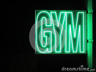Lit gym sign glowing green Stock Photo
