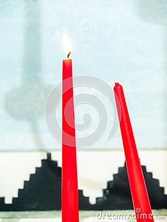 lit red candle for esoteric spell Stock Photo