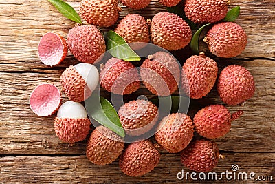 Litchi, lichee, lychee, or lichi, Litchi chinensis on old rustic wood background. Horizontal top view Stock Photo