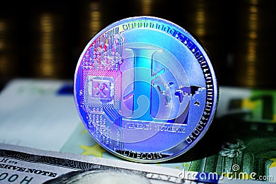 Litecoin LTC is surrounded by a money background Stock Photo