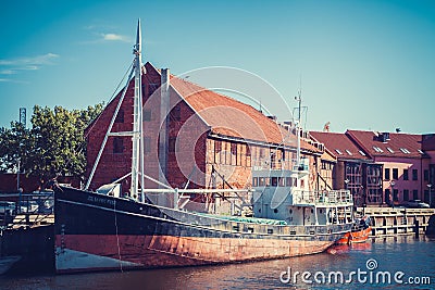 LITHUANIA, KLAIPEDA - JULY 20, 2016: boat on Dane river in oldtown of Klaipeda. Lithuania. Editorial Stock Photo