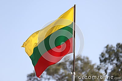 Lithuanian flag flying on flagpole Stock Photo