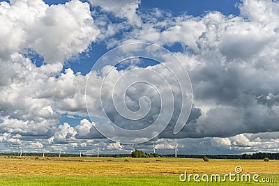 Lithuanian Landscape and Nature with Windmill and Cloudy Blue Sky in Background Stock Photo