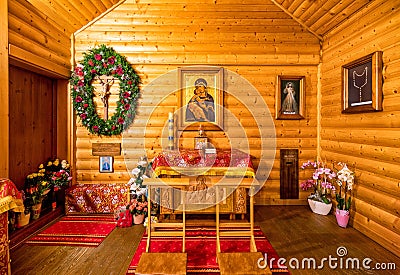 Praying people in front of the altar in the chapel Editorial Stock Photo