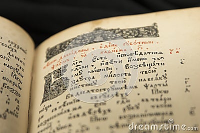 Litography book page. Old initial letter. Open book with beutiful letters. Art illustrated page. Reading of opened book educate r Stock Photo