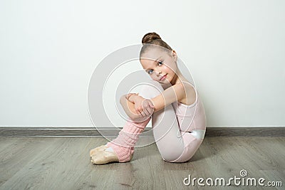 A little adorable young ballerina poses Stock Photo