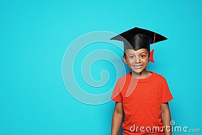 Little African-American school child with graduate cap Stock Photo