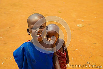 Little African Maasai children look friendly at the camera Editorial Stock Photo