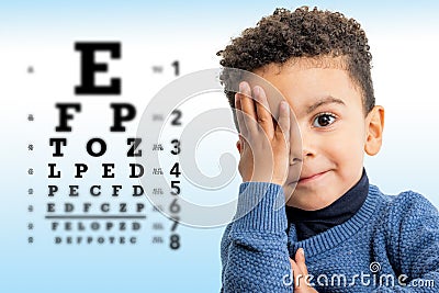 Little afro american boy doing vision test Stock Photo