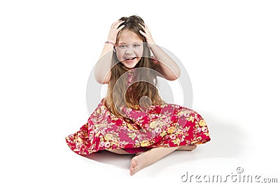 Little amusing girl holding her hands behind her head. Stock Photo