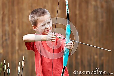 Little archer with bow and arrows Stock Photo