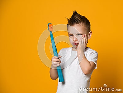 Little Asian boy suffering from toothache - Dental problem. Stock Photo