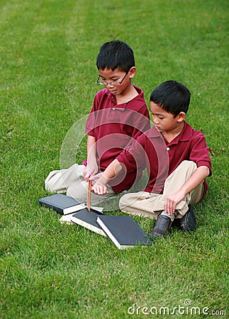 Little asian boys with books Stock Photo