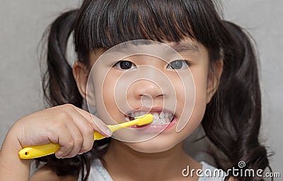 Little asian cute girl brush teeth . Stock Photo