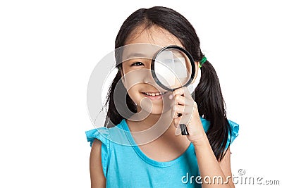 Little asian girl with magnifying glass Stock Photo