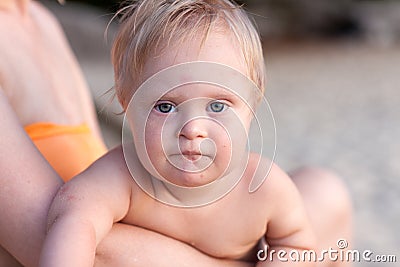 Little baby in the arms of mother Stock Photo