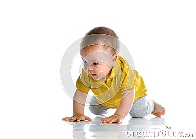 Little baby boy in casual clothes crawling on floor Stock Photo